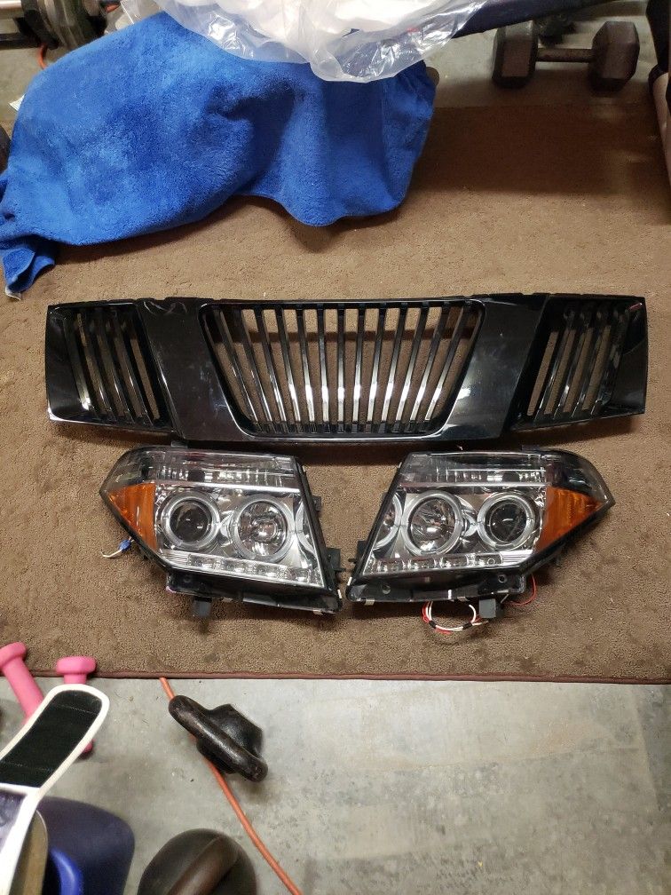 2006 Nissan FRONTIER BLACK GRILL AND HEADLIGHT $70