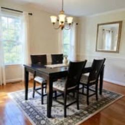 Beautiful Wood Dining 
Set with Glass Top and 4 Tall Chairs..Reduced to Sell..moving