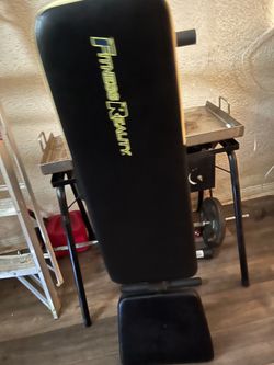 Weight bench with metal bar and 2 25 pounds weight plates