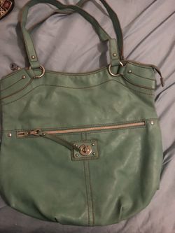 Stylish green handbag with front zipper pocket