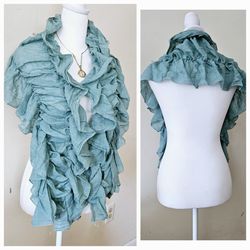 Seafoam Green Ruched Ruffled Decorative Women's Scarf. 70% Polyester, 30% Cotton. 

Makes a great holiday Christmas gift or stocking stuffer. Ships vi