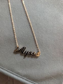 Gold toned necklace with name Alyssa