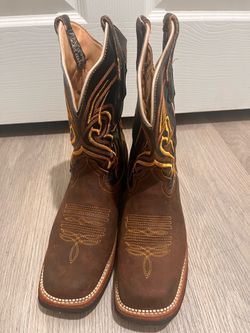 Cowboy’s or girl’s boots .