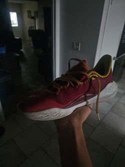 Under Armour Curry 11s in the bruce Lee fire color way