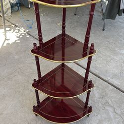 Brown 4 shelf with gold on it antique
