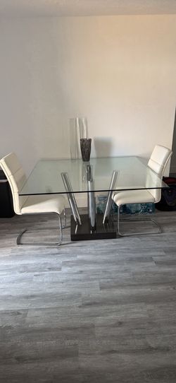 Glass table chairs included