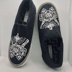 WOMANS SLIP ON GYM SHOE"S BLACK CANVAS WHITE DESIGN