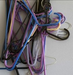 34 assorted plastic hangers