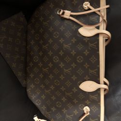 Louie Vuitton Never full MM Brand New  Never Used 