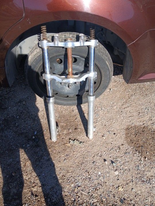 Motorcycle front forecast assembly