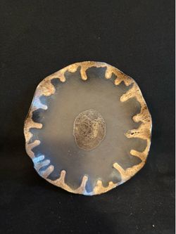 Handmade ceramic dish featuring an organic, fluid glaze effect