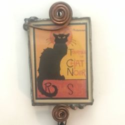 Tournee du chat noir pendant