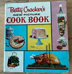 Betty Crocker’s New Picture Cook Book, lovingly used since 1960,binding separated from spine but there.