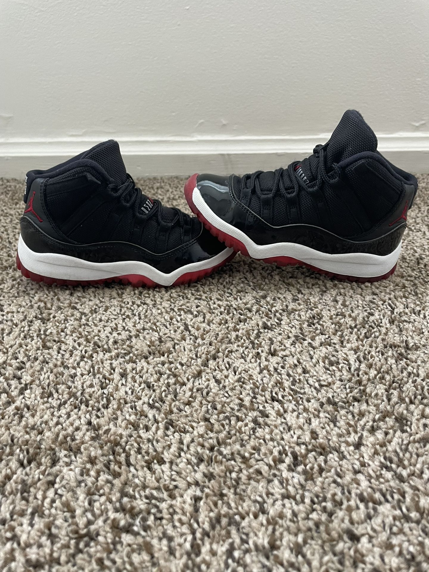 Kids Retro Jordan 11s “Bred”