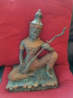 Statute with the musical instrument the dimension are 13.700"H 12"W and 7"D series byers with a reasonable offers please