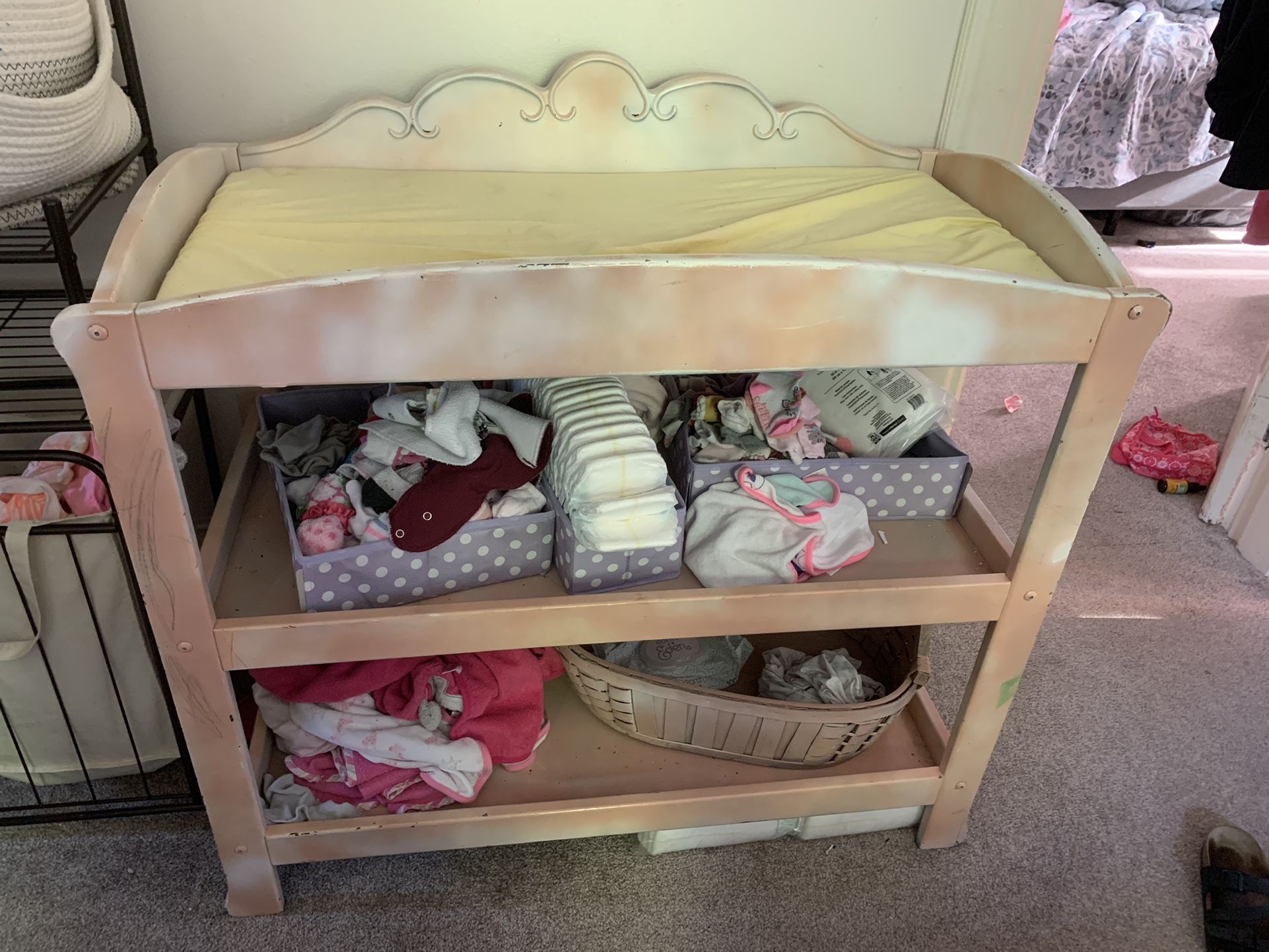 Pink and white changing table