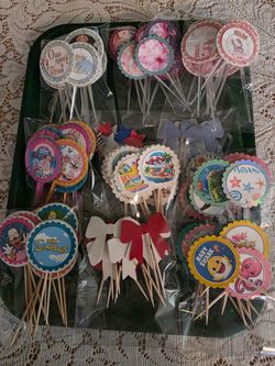 Multiple handmade cupcake toppers