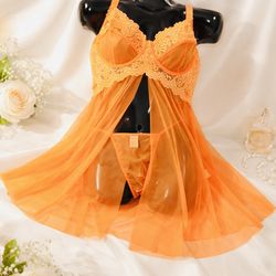 Elegant orange lace lingerie set featuring a soft, flowing babydoll design with matching panty. Crafted with delicate sheer fabric and feminine lace d