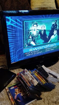 Tv with new remote, dvd Blu-ray player, and Movies all together