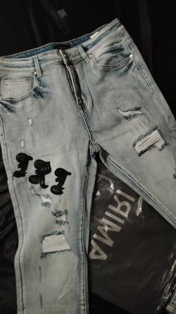 Light Wash Distressed Jeans with Graphic Patch
