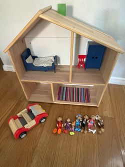 Doll house with wooden dolls