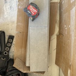 6”x23.5” gray Matt floor tile 14 and a half pieces