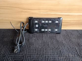 GE UltraPro 12-Outlet Surge Protector with a desktop USB charging dock