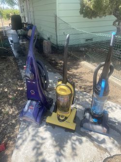 2 Blue Ones Are Bissell An Yellow Is A Hoover