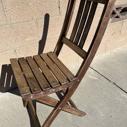 vintage wood slat folding chair, a design that was produced extensively during the early to mid-20th century.