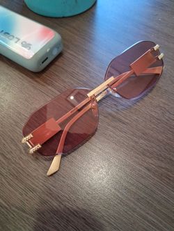 Versace Rimless Oval Sunglasses