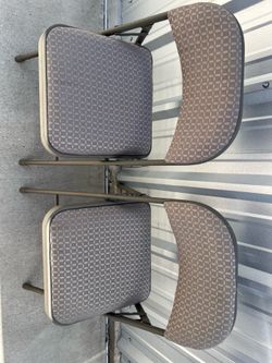 2 folding metal chairs