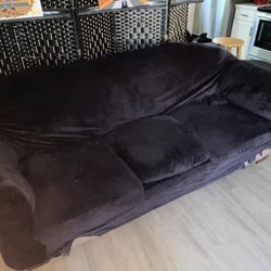 TWO COUCHES W/ COVERS