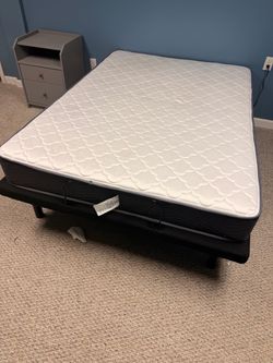 Adjustable bed, dresser and night stand. Bed has a remote