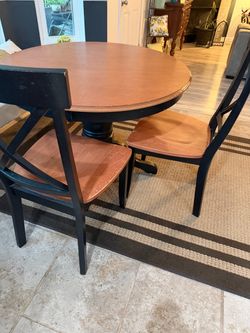 Round table with two chairs