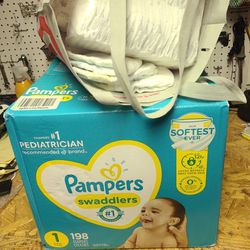 Size 1 Pampers swaddlers 198 New in box plus another 45 plus diapers loose 