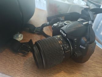 DSLR Nikon 3000d with two lenses battery charger and many other things and case