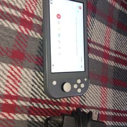 Nintendo switch, light in good condition.+it Comes With A Pair Of Wireless Headphones 