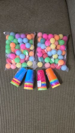 Colorful tennis balls and cups