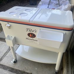Tito’s Vodka rolling cooler with canvas cover slip