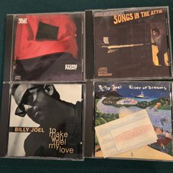 Cds Billy Joel and Jack Johnson and Donovan Franenreiter