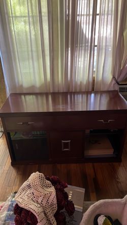 Dark wood media console/TV stand with storage and sliding glass doors