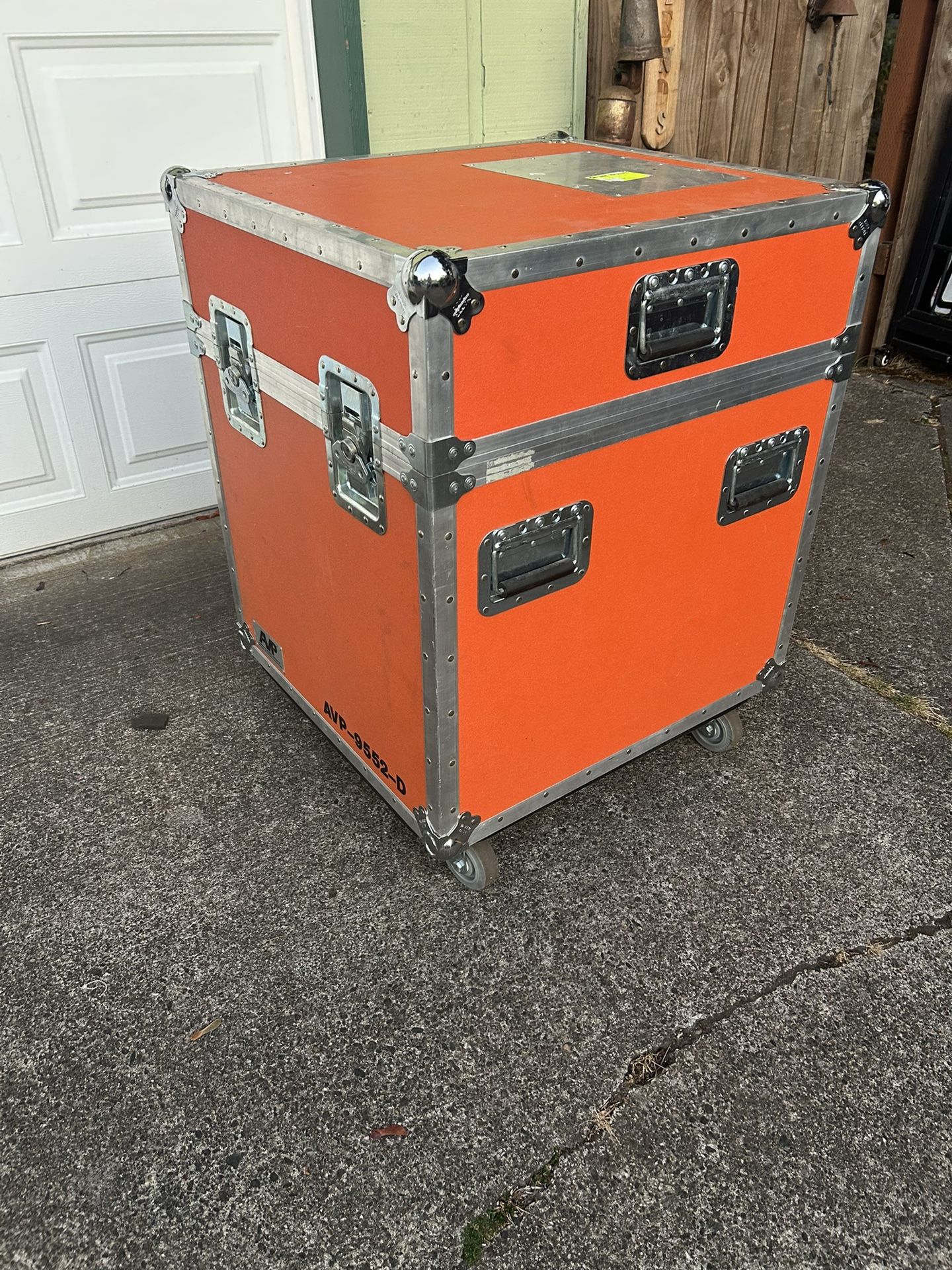 2 Anvil style cases both in good condition. The larger one has nice rolling wheels and is orange. The measurements are 28 inches tall 25 1/2 inches lo
