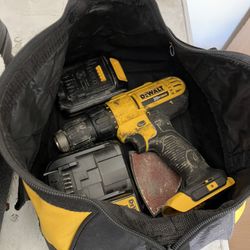 Drill, battery, charger, and bag all by DeWalt 