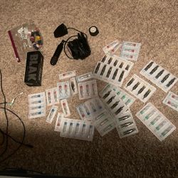 Tattoo Gun And Needles And Ink