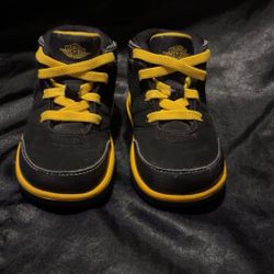 Black and yellow Jordans