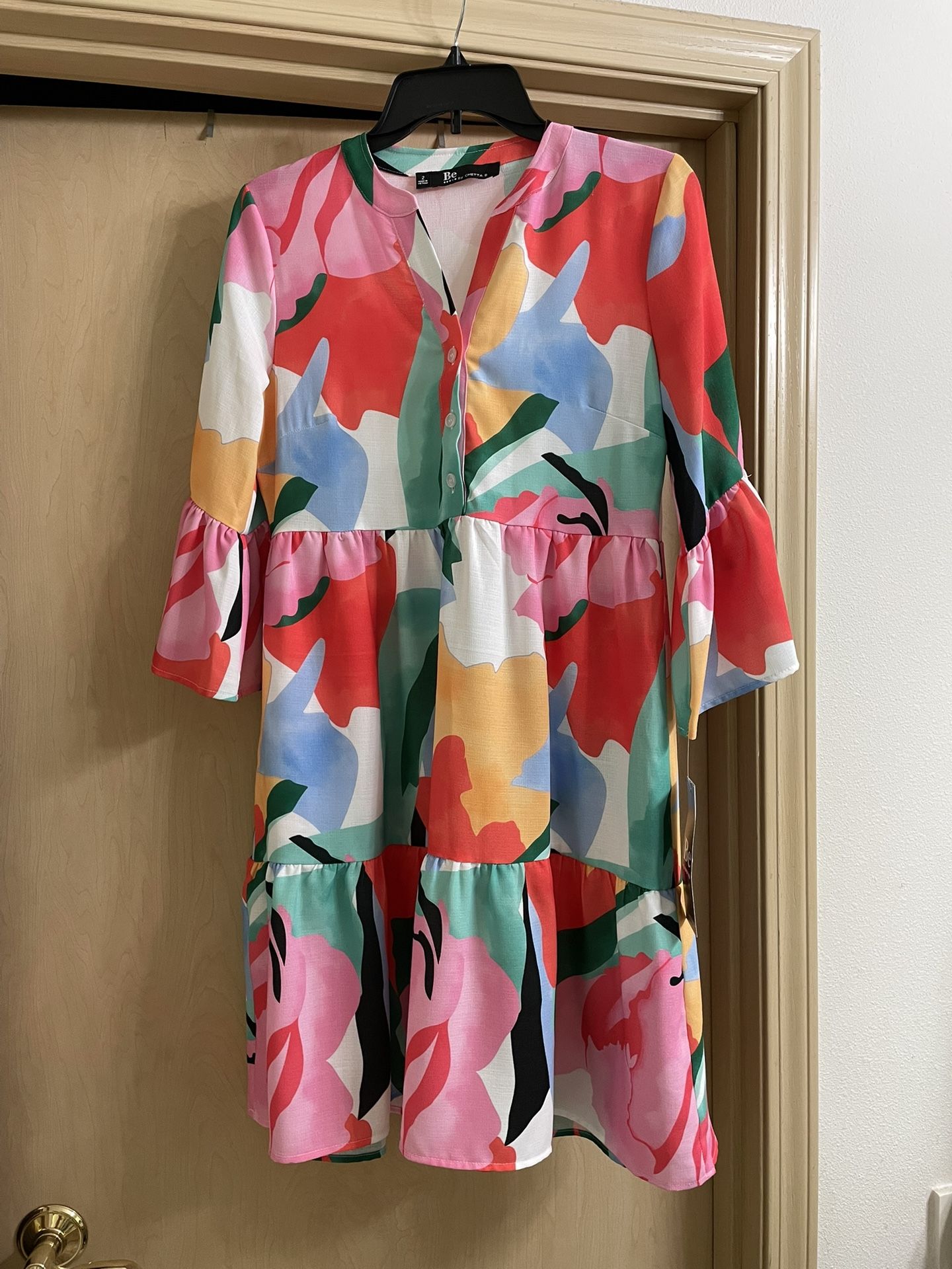 New with tags women’s size 2 (extra small) multicolored print dress with pockets