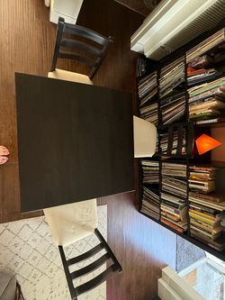 Small table and three padded chairs