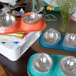 Pet feeding bowls with vibrant colors.