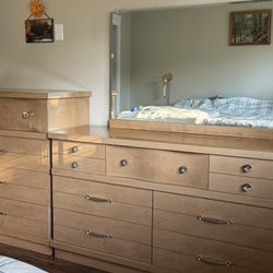 Two dressers with a mirror. 