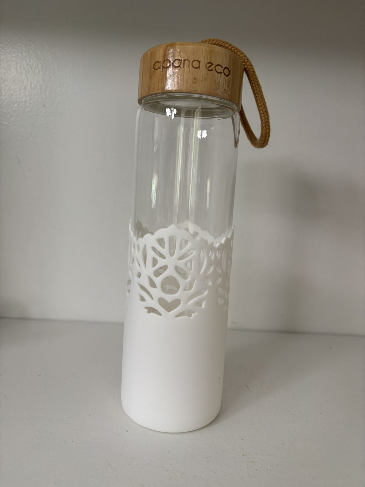 apana Eco Glass Water Bottle With White Silicone Sleeve And Wood Top